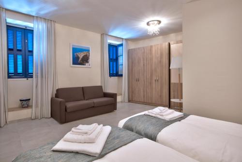 Postel nebo postele na pokoji v ubytování The Suites – Piazza Kirkop