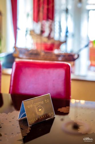 a welcome sign sitting on top of a table at Villa Lake View in Ohrid