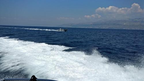 a boat in the middle of the ocean at Guesthouse Lidija in Sutivan
