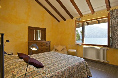 En eller flere senger på et rom på Rustico alla Spiaggia
