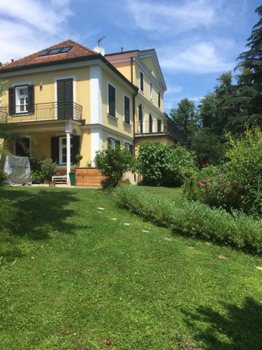 a large house with a yard in front of it at Louisenvilla in Bad Gleichenberg
