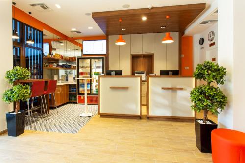 a lobby of a store with potted plants at Best Western Terminus Hotel in Sofia