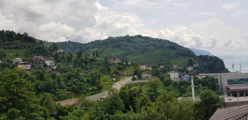 a town on a hill with a mountain at Yellow House - Vaja in Sarpi