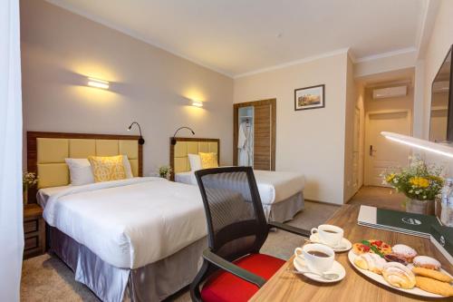 Ένα ή περισσότερα κρεβάτια σε δωμάτιο στο Garden Hotel & SPA
