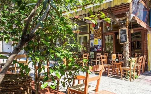 A restaurant or other place to eat at Stefanias sunny Acropolis Studio on Drakou pedestrian