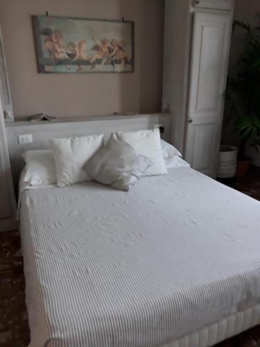 Ένα ή περισσότερα κρεβάτια σε δωμάτιο στο Casa Sulla Laguna