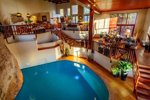 an overhead view of a swimming pool in a house at Ulwazi Rock Lodge in Hazyview