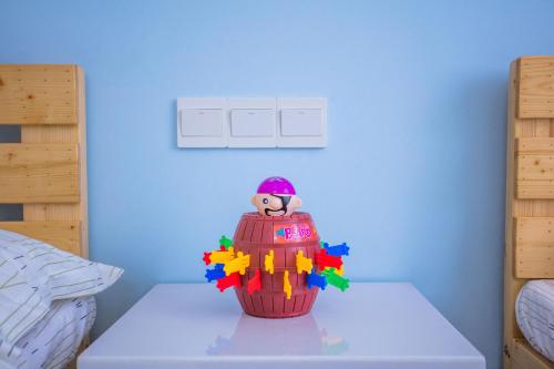 a lego toy on a table in a bedroom at Murphy Youth Hostel Guilin桂林北站莫非青年旅舍 in Guilin