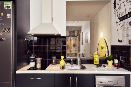 a kitchen with a sink and a counter top at Free Hostels Barcelona in Barcelona