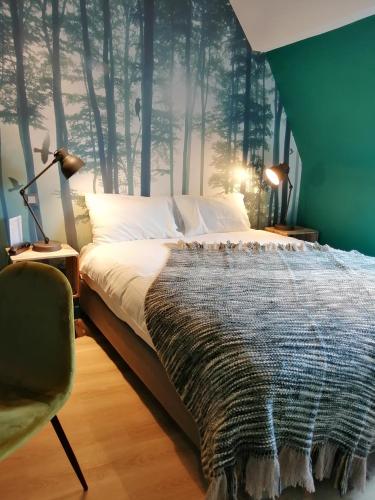 Un ou plusieurs lits dans un hébergement de l'établissement Hotel Du Cygne Tours