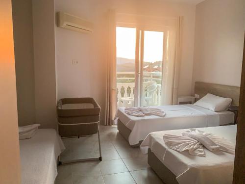 Postel nebo postele na pokoji v ubytování Kaizen Gate Hotel