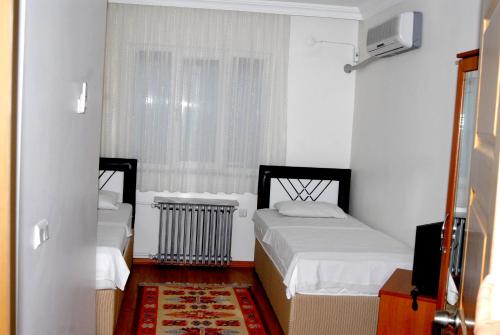 Katil atau katil-katil dalam bilik di Köprücü Hotel