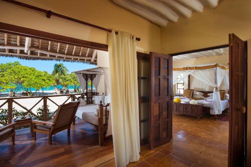 Postel nebo postele na pokoji v ubytování Neptune Pwani Beach Resort & Spa Zanzibar - All Inclusive