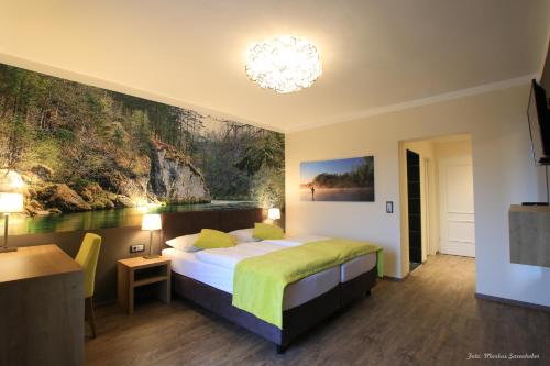 Säng eller sängar i ett rum på Gasthof Alpenblick