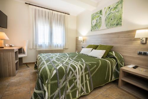 Postel nebo postele na pokoji v ubytování Hotel Victor