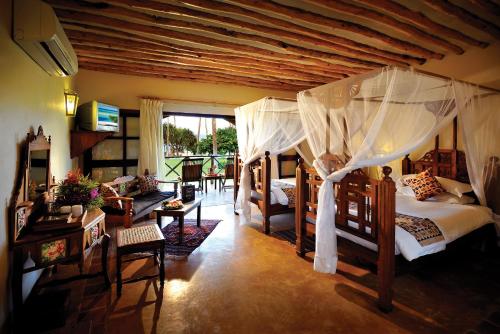 Postel nebo postele na pokoji v ubytování Neptune Pwani Beach Resort & Spa Zanzibar - All Inclusive