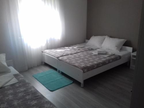Ένα ή περισσότερα κρεβάτια σε δωμάτιο στο Rooms Nikola Rule Ostojic