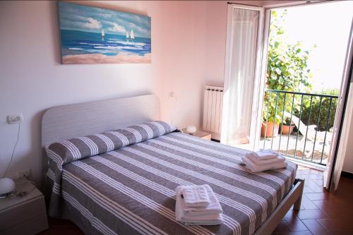 Postel nebo postele na pokoji v ubytování Casa Cinzia Bonassola Cinque Terre