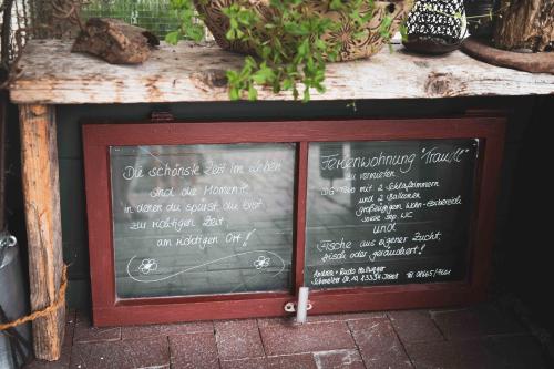 a chalkboard sign with a menu on it at Ferienwohnung Traudl in Inzell