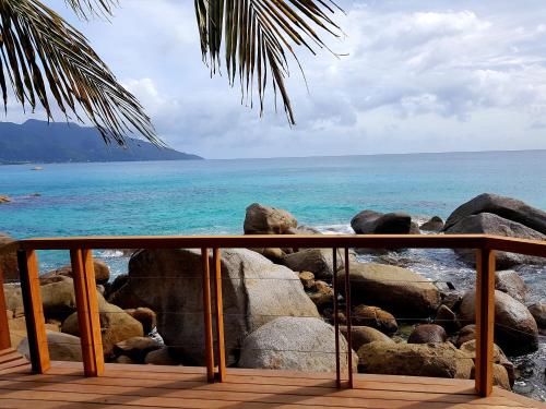 a view of the ocean from a balcony at Marquise & Infinity villas in Glacis