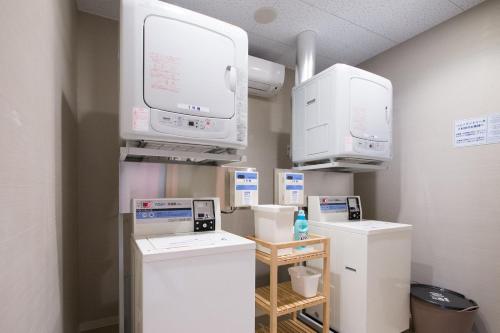 a hospital room with machines and a tv at Super Hotel Tokyo JR Shinkoiwa in Tokyo