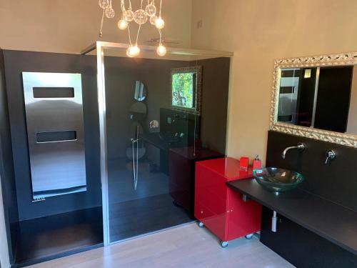 a bathroom with a shower and a sink and a mirror at Exclusive Loft 300mt by the sea Forte dei Marmi in Forte dei Marmi