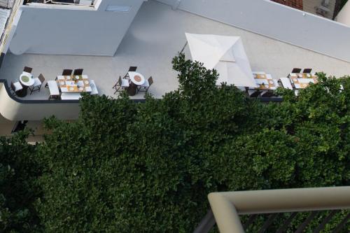 an overhead view of a building with tables and chairs at Leblon Design Hotel in Rio de Janeiro