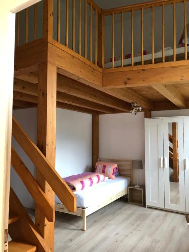a bunk bed in a room with a loft at Apartment Italy in Interlaken