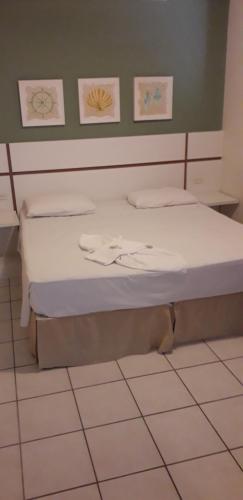 Hotel Jangada Flatにあるベッド