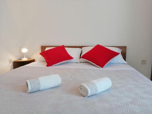 Postel nebo postele na pokoji v ubytování Apartments Pharos