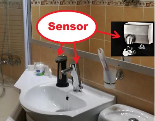 a bathroom with a sink and a sign that says senor at CoquetteHouse Parc Gara de Nord in Bucharest