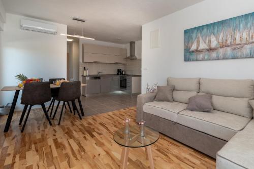 a living room with a couch and a table at Villa Helena in Trogir