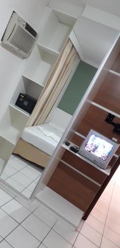 Hotel Jangada Flatにあるテレビまたはエンターテインメントセンター