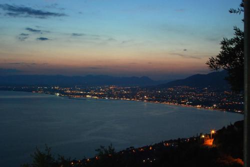 a view of a large body of water at night at Olive Stonehouses in Kalamata