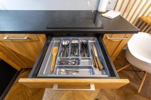 a drawer in a kitchen with utensils in it at LvApart вул Ковжуна 2 кім ізол кухня студія звітні документи in Lviv