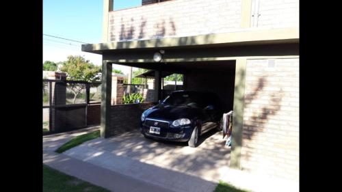 a car is parked inside of a garage at Santa isabel in Embalse