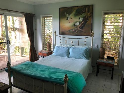 Ένα ή περισσότερα κρεβάτια σε δωμάτιο στο Mission Beach Escape BnB