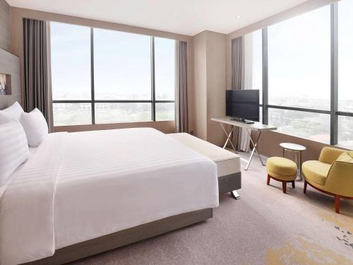 Katil atau katil-katil dalam bilik di Novotel Samator Surabaya Timur