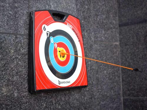 a dart board with a arrow in the center at Novotel Chennai OMR in Chennai