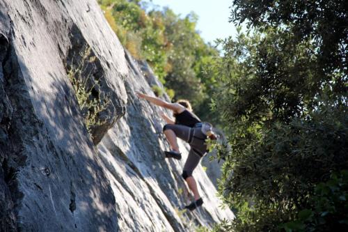 a person is climbing on a rock wall at Guesia Village Hotel e Spa in Foligno