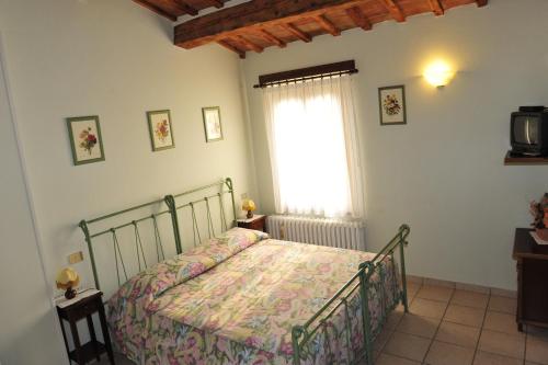מיטה או מיטות בחדר ב-Agriturismo La Caputa