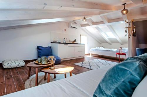 a room with a bed and a living room at Villa Nea Seaview 3-apartments! in Rovinj