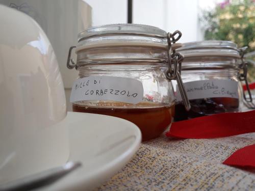 two jars of honey sitting on a table at Sa Ramadura in Pula