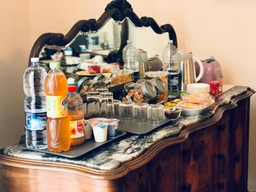 a table with food and drinks on it at Casa del Marchese B&B in Riposto
