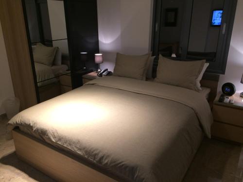 Kennedy Deluxe Suitesにあるベッド