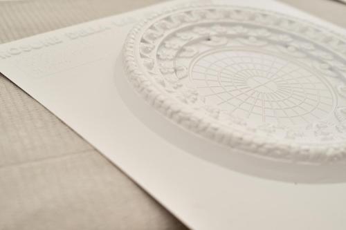 a white plate on top of a piece of paper at Dimora Casanello in Lecce