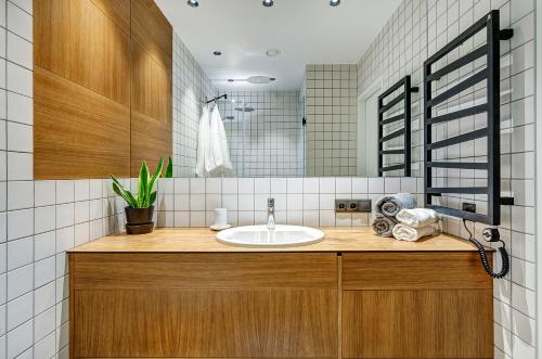 a bathroom with a sink and a mirror at Downtown apartment in Vilnius str. in Vilnius