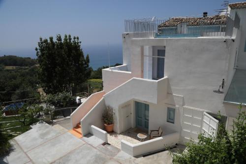 an aerial view of a white house at Borgo Rosso di Sera - Resort Country Chic in San Lucido