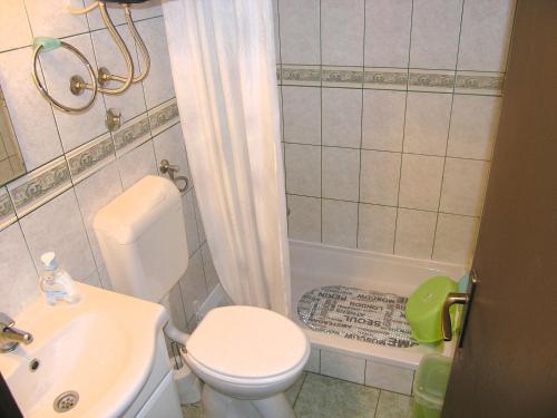 a small bathroom with a toilet and a sink at Studio Apartment Tamara in Krk