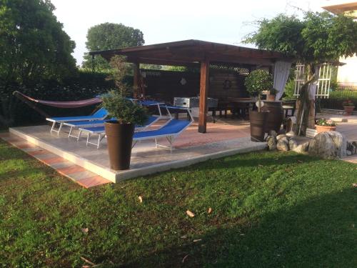 a group of chairs and a hammock in a yard at Villa Margherita in Montaquila